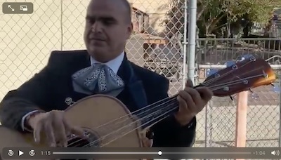 Image of Mariachi Cisneros' rep Juan Cisneros playing Guitarron