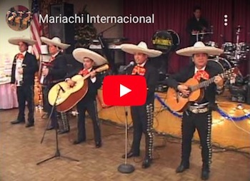 Mariachi Internacional performing "El Pastor" on stage